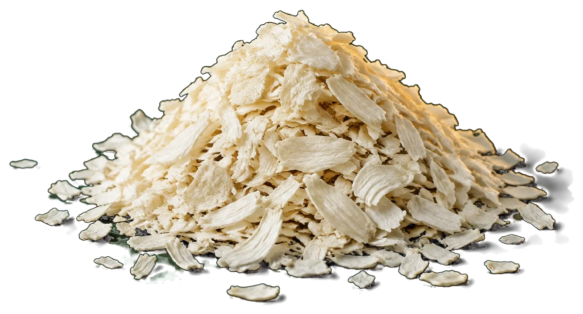 A heap of dehydrated white onion flakes